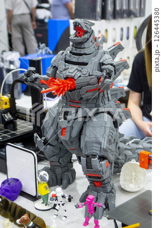 Detailed Art object printed on 3D printer. Robot toy created on 3D printer. High-precision 3D printing technologies. Creation of three-dimensional models. Modern new innovative technology. 126445380