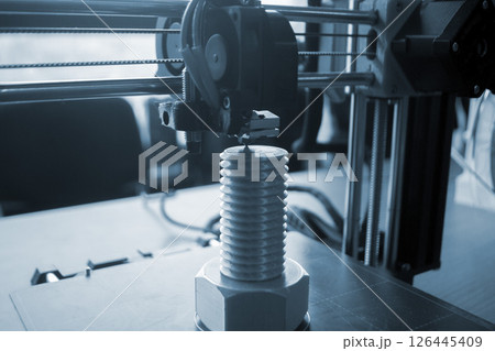 The process of printing on a 3D printer. 3D printer printing object from molten plastic close-up. Creative creation of model on 3D printer. New modern technologies of 3D printing. Additive technology 126445409
