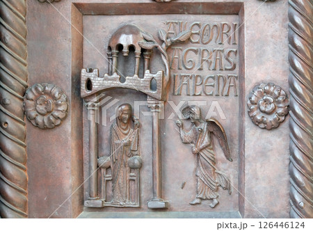 Annunciation of the Virgin Mary on the San Ranieri gate of the Cathedral St. Mary of the Assumption in Pisa, Italy Annunciation of the Virgin Mary on the San Ranieri gate of the Cathedral St. Mary of the Assumption in Pisa, Italy 126446124