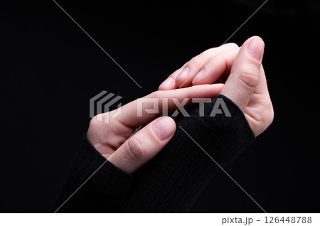 Female hands on a black background. Concept of tenderness and self-care. 126448788