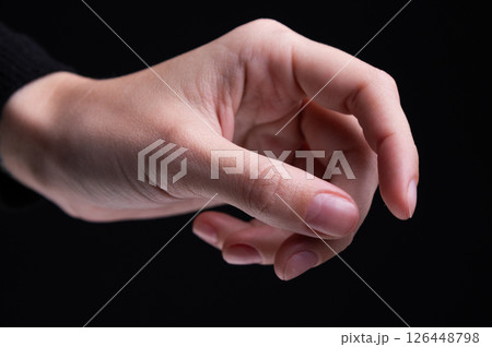Female hands on a black background. Concept of tenderness and self-care. 126448798