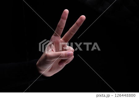 Woman's hand showing two fingers up, . Peace, fight, victory symbol, letter V in sign language or number two or second Woman's hand showing two fingers up, . Peace, fight, victory symbol, letter V in sign language or number two or second 126448800