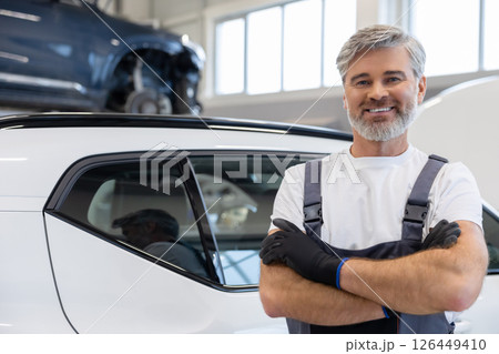 Mechanic standing with arms crossed 126449410