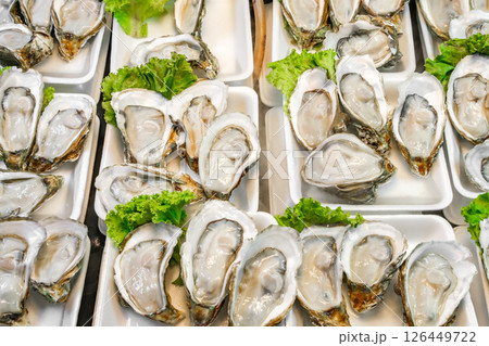 fresh opened oysters at the fish market fresh opened oysters at the fish market 126449722
