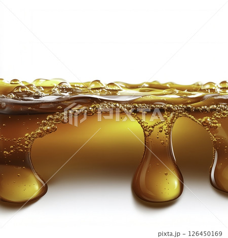 Golden Honey Dripping from Wooden Spoon Against Bright Background Displaying Sweetness 126450169