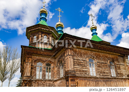 Wooden Orthodox church. Holy Trinity Cathedral in Karakol city, Kyrgyzstan, architecture Wooden Orthodox church. Holy Trinity Cathedral in Karakol city, Kyrgyzstan, architecture 126451897