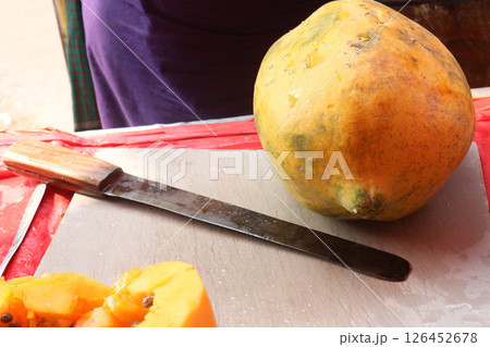 ripe papaya on shop for sell 126452678