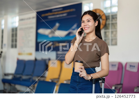 Travel adventure with smartphone and coffee at the airport 126452773