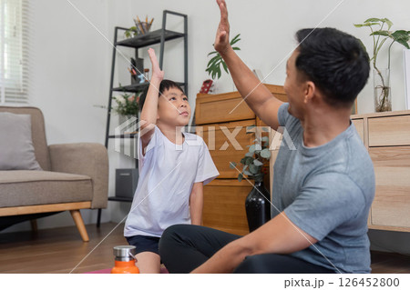 Family bonding through playful fitness activities at home Family bonding through playful fitness activities at home 126452800