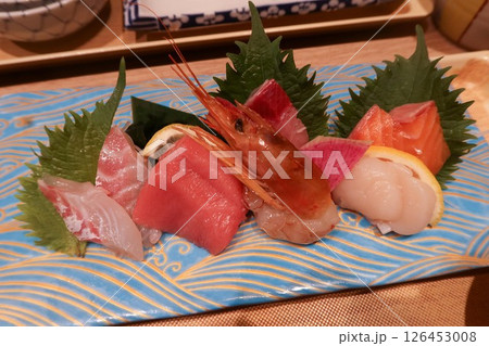 close up of assorted Japanese sashimi seafood sushi fish including raw shrimp, salmon, tuna, scallop and Croaker close up of assorted Japanese sashimi seafood sushi fish including raw shrimp, salmon, tuna, scallop and Croaker 126453008
