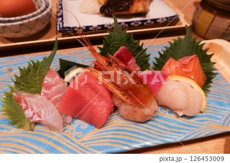 close up of assorted Japanese sashimi seafood sushi fish including raw shrimp, salmon, tuna, scallop and Croaker close up of assorted Japanese sashimi seafood sushi fish including raw shrimp, salmon, tuna, scallop and Croaker 126453009