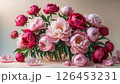 Colorful bouquet of peonies in a glass vase floral arrangement 126453231