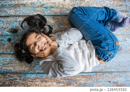 Little girl happy to show her first fallen tooth 126453592