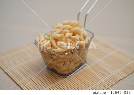 Crispy Fried Snacks in a Metal Basket 126454038