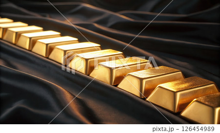 Close up of gold bars arranged black satin fabric, luxurious 126454989