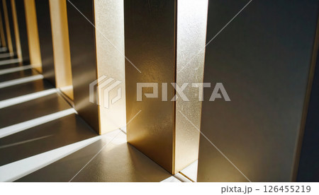 Close up of metallic and gold colored vertical panels with shadows 126455219