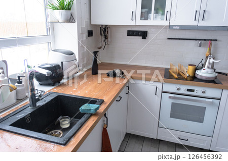 General cleaning in the kitchen, surface cleaning and grease removal products, a mess General cleaning in the kitchen, surface cleaning and grease removal products, a mess 126456392