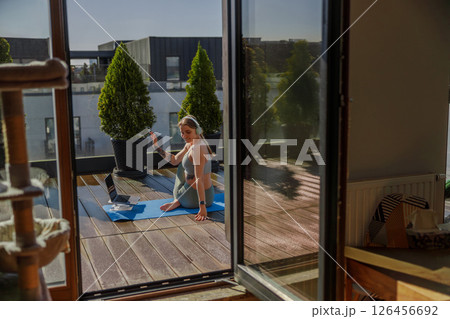 Engaging in Outdoor Yoga Practice within a Modern Apartment for a Refreshing Lifestyle Engaging in Outdoor Yoga Practice within a Modern Apartment for a Refreshing Lifestyle 126456692