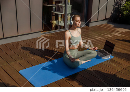 Participating in Meditation and Mindfulness Practice on a Beautiful Sunny Deck Environment Participating in Meditation and Mindfulness Practice on a Beautiful Sunny Deck Environment 126456693