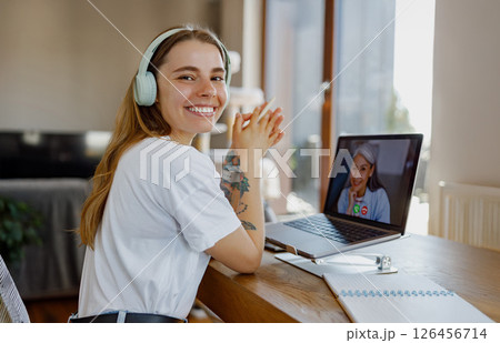 Participating in a Remote Learning Session with a Student via Video Call on the Internet 126456714