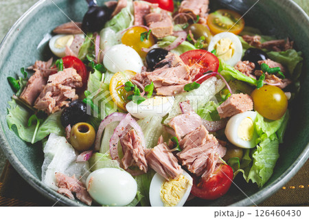 salad with canned tuna, vegetable salad with quail eggs, lettuce, red onion , cherry tomatoes , olives, keto food, healthy food, homemade, no people 126460430