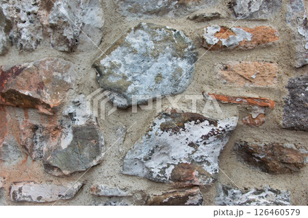 Structural wall of the ancient building of the last century from a stone. Old brick wall texture. Grunge wide brickwall. Copy Space. 126460579