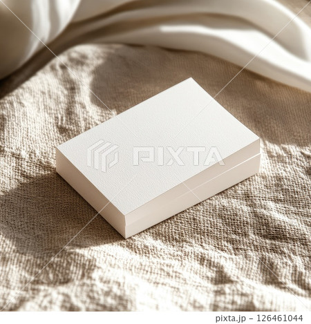 A professional business card mockup on textured paper with a neutral background. High-detail and elegant, perfect for showcasing branding and design projects. 126461044