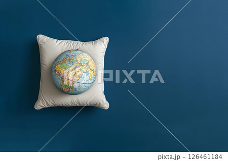 world sleep day, globe on a sleeping pillow, top view, copy space 126461184