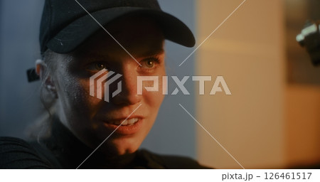 Close Up of Aggressive Female Criminal Aiming the Gun, Talking to Unrecognizable Opponent Close Up of Aggressive Female Criminal Aiming the Gun, Talking to Unrecognizable Opponent 126461517