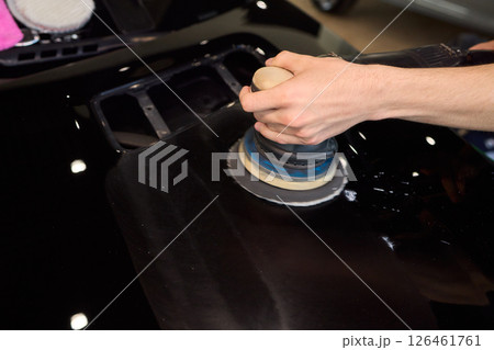 A Detailed Close Up of the Car Polishing Process in the Field of Automotive Detailing A Detailed Close Up of the Car Polishing Process in the Field of Automotive Detailing 126461761