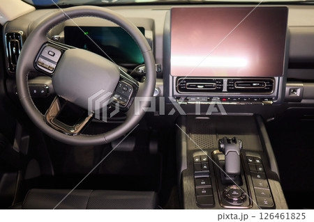 The Modern Car Dashboard Touchscreen Display features a sleek and futuristic interface design The Modern Car Dashboard Touchscreen Display features a sleek and futuristic interface design 126461825