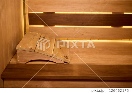 Experience the Cozy Wooden Sauna Interior Equipped with Inviting Warm Lighting and Ambiance Experience the Cozy Wooden Sauna Interior Equipped with Inviting Warm Lighting and Ambiance 126462176