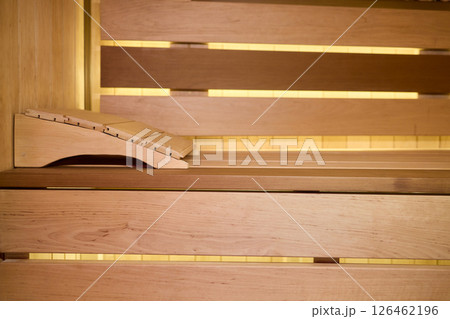 Experience the Cozy Wooden Sauna Interior Equipped with Inviting Warm Lighting and Ambiance Experience the Cozy Wooden Sauna Interior Equipped with Inviting Warm Lighting and Ambiance 126462196