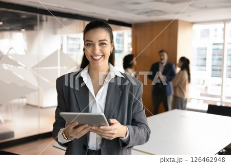 Portrait of corporate trainer posing in boardroom with digital tablet 126462948
