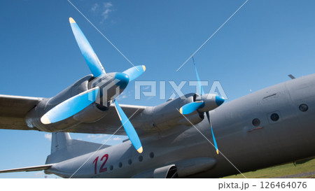 A close look at a vintage Soviet aircraft with blue propellers showcases its design during a Russian aviation event, evoking nostalgia for aviation history. A close look at a vintage Soviet aircraft with blue propellers showcases its design during a Russian aviation event, evoking nostalgia for aviation history. 126464076