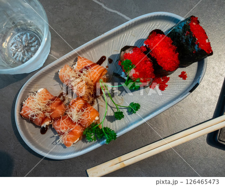 Gunkan roll with philadelphia salmon and tobiko 126465473