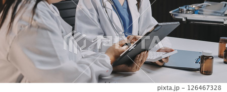 doctors and nurse having informal meeting in hospital canteen doctors and nurse having informal meeting in hospital canteen 126467328