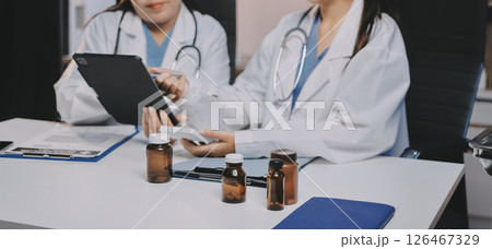 doctors and nurse having informal meeting in hospital canteen doctors and nurse having informal meeting in hospital canteen 126467329