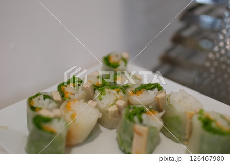 Shrimp Spring Rolls on a Plate with Sauce 126467980