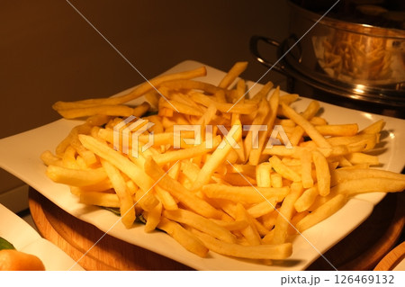 French Fries with Ketchup Pommes Frites on a turntable isolated on white background 126469132