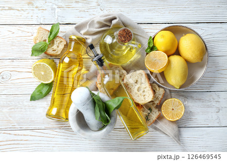 The concept of Italian cuisine, olive oil, on a light background. 126469545