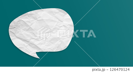 White speech bubble crumpled paper isolated on green background 126470124