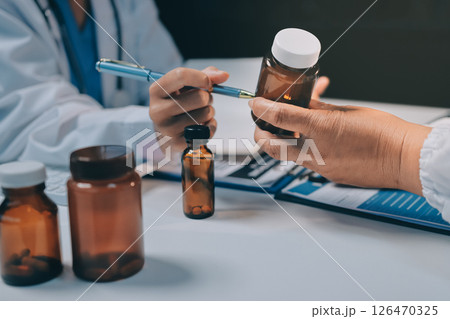 doctors and nurse having informal meeting in hospital canteen 126470325