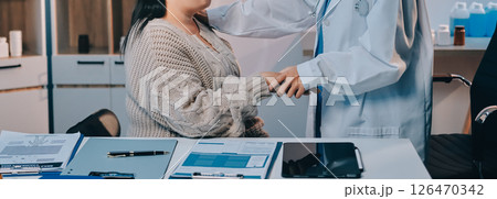 Medicine doctor hand reassuring her female patient 126470342