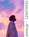 男性の横顔と夕焼けの空の背景　AI生成素材 126470692
