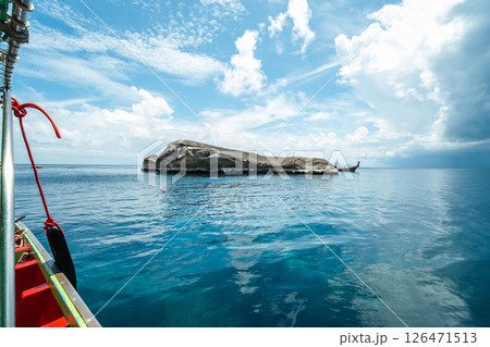 View of the island from the boat, rocks and islands during the day, summer travel View of the island from the boat, rocks and islands during the day, summer travel 126471513