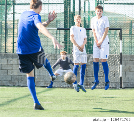 Free kick on goal in football 126471763