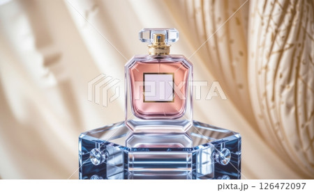 Elegant perfume bottle on a reflective surface with soft background. Elegant perfume bottle on a reflective surface with soft background. 126472097