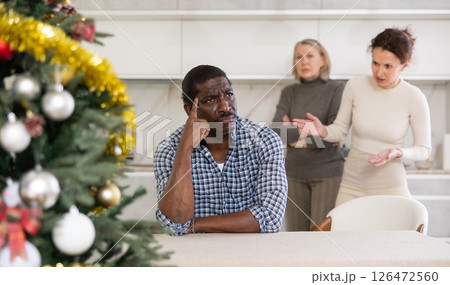 Adult woman and elderly woman quarreling with man Adult woman and elderly woman quarreling with man 126472560