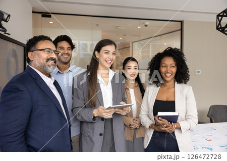 Happy businesspeople exuding satisfaction with sales growth or teamwork results Happy businesspeople exuding satisfaction with sales growth or teamwork results 126472728